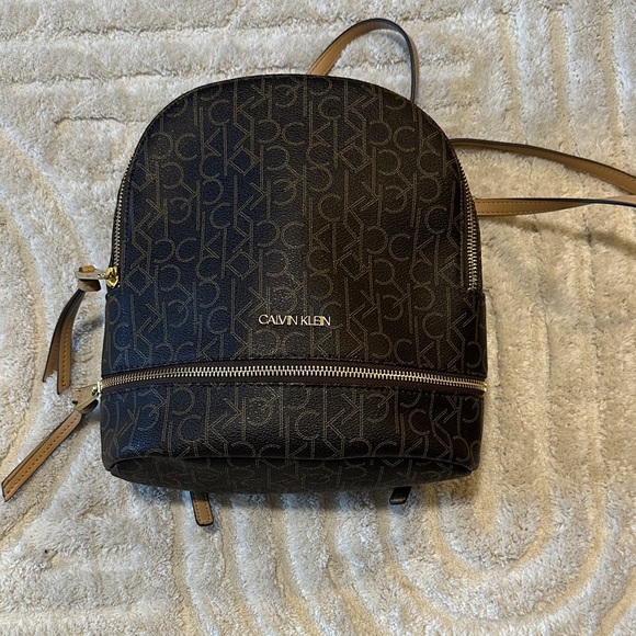 Calvin Klein Handbags - Calvin Klein Monogram Black and Brown Backpack